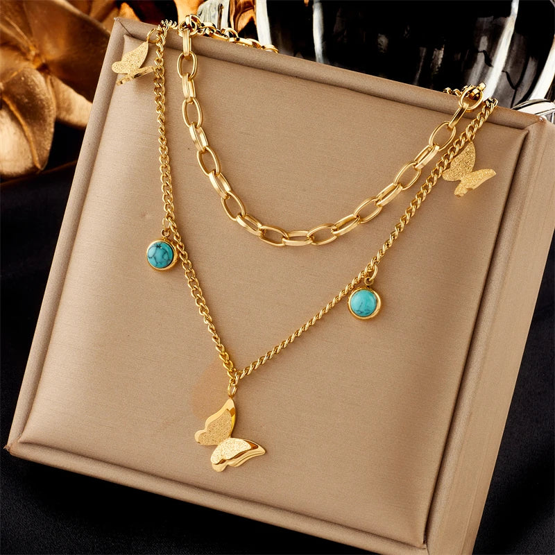 DIEYURO 316L Stainless Steel Butterfly & Moon Pendant Necklace β Blue Eyes Multilayer Choker