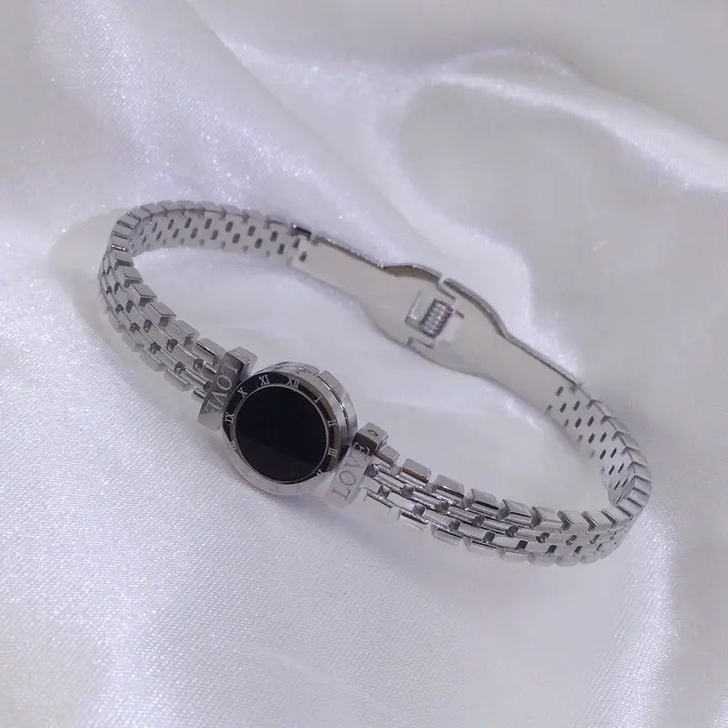 ZAKOL Black Shell Roman Numeral Titanium Steel Bangle β Hollow Circle Button Bracelet