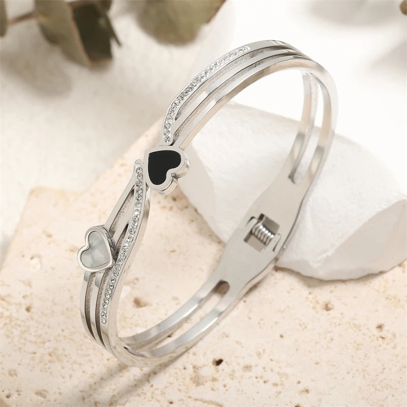ZAKOL Black Shell Roman Numeral Titanium Steel Bangle β Hollow Circle Button Bracelet