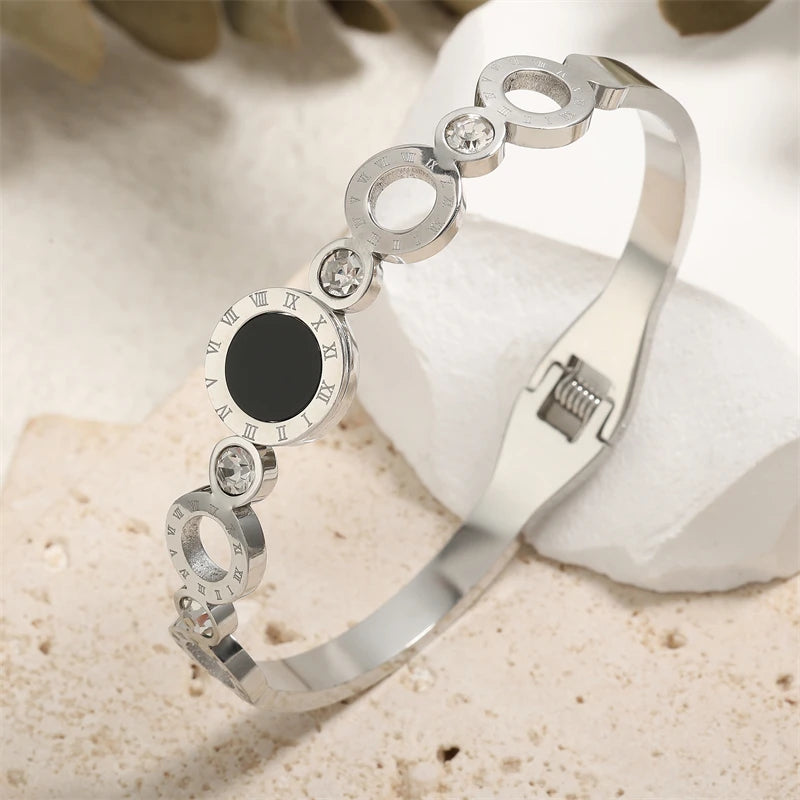 ZAKOL Black Shell Roman Numeral Titanium Steel Bangle β Hollow Circle Button Bracelet