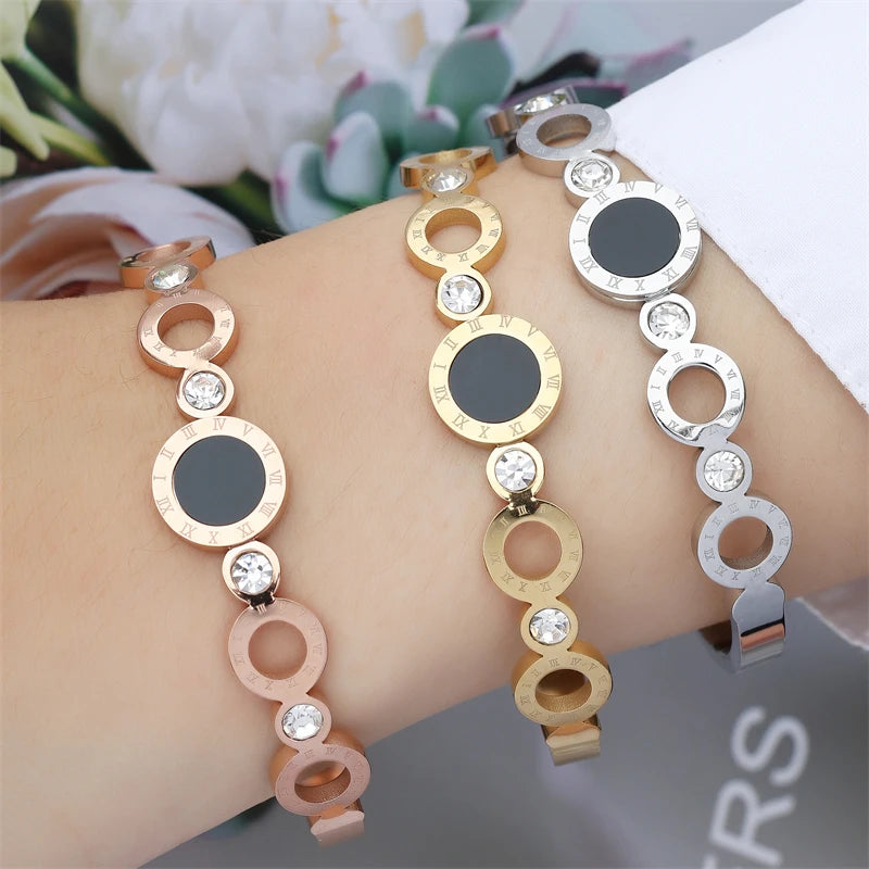 ZAKOL Black Shell Roman Numeral Titanium Steel Bangle β Hollow Circle Button Bracelet