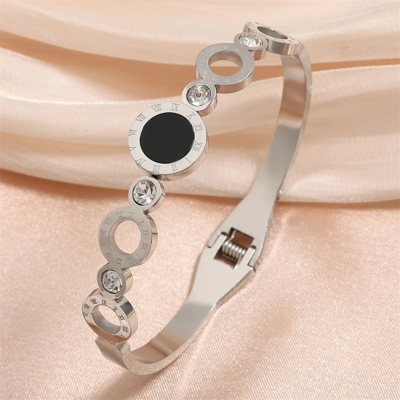 ZAKOL Black Shell Roman Numeral Titanium Steel Bangle β Hollow Circle Button Bracelet