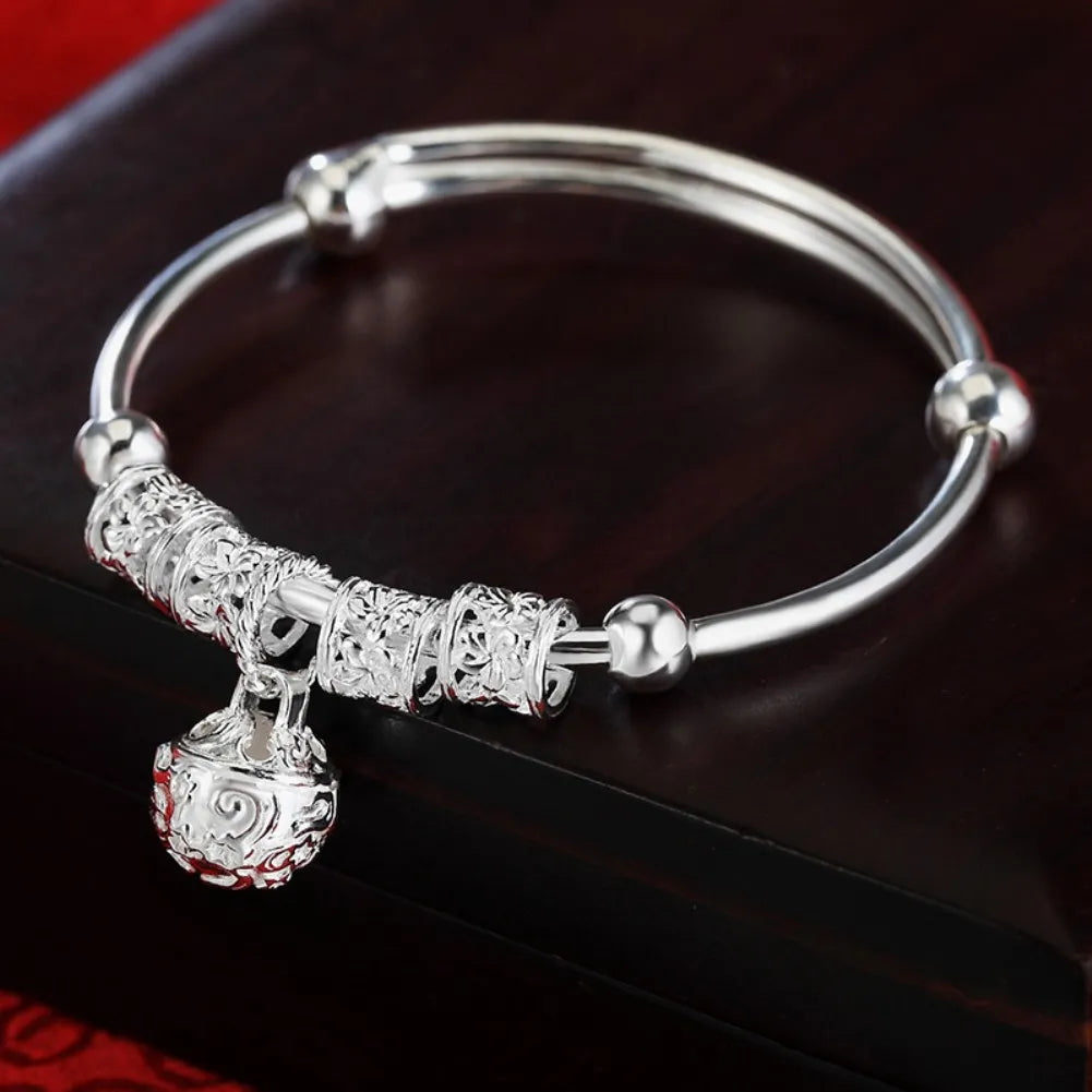 Silver Hollow Bell Bangle Bracelet – Adjustable Fashion Jewelry for Women
