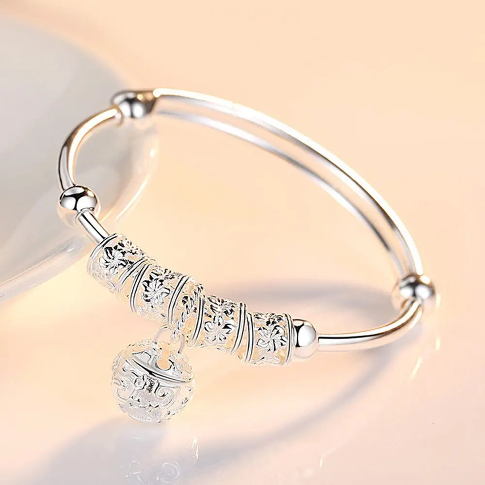 Silver Hollow Bell Bangle Bracelet – Adjustable Fashion Jewelry for Women