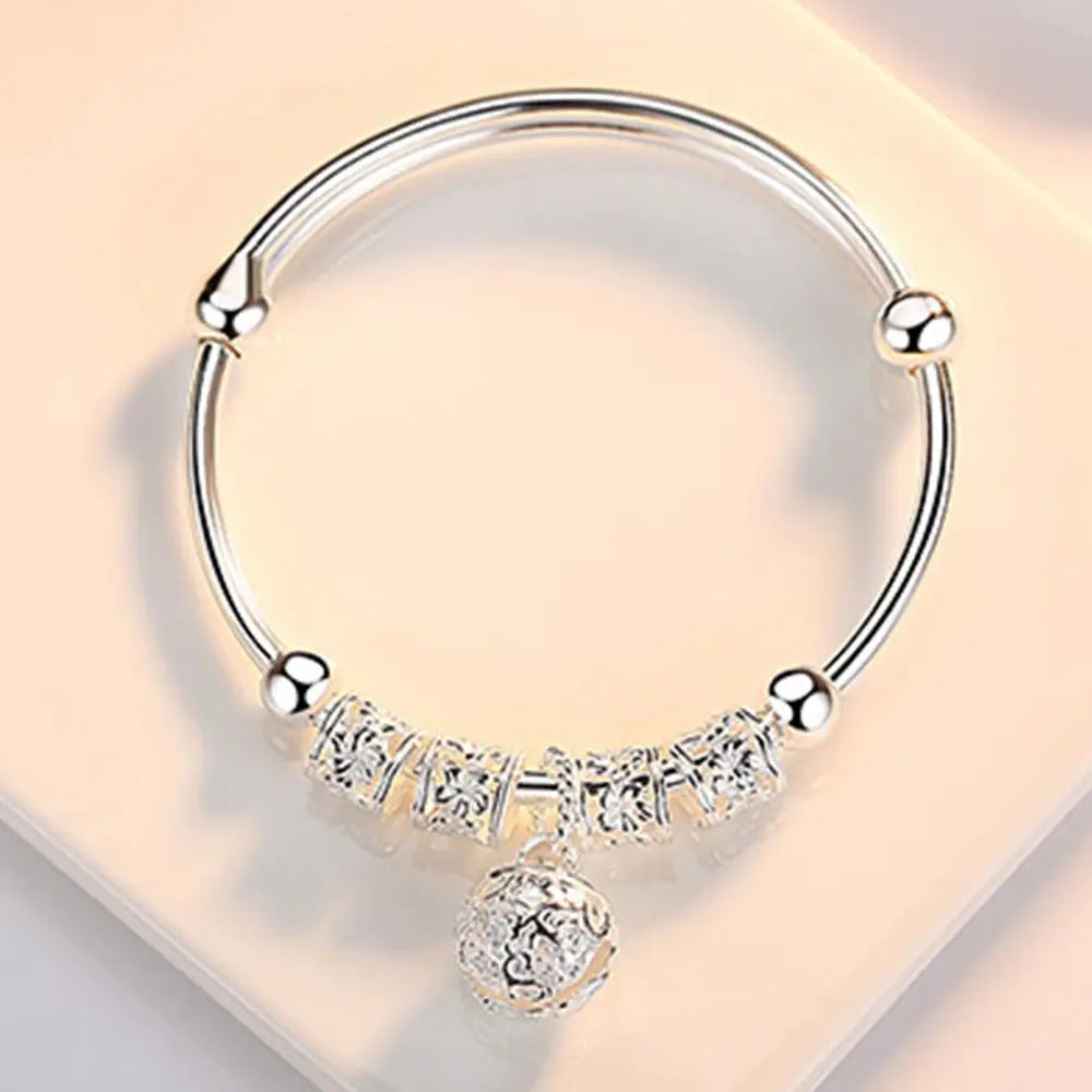 Silver Hollow Bell Bangle Bracelet – Adjustable Fashion Jewelry for Women